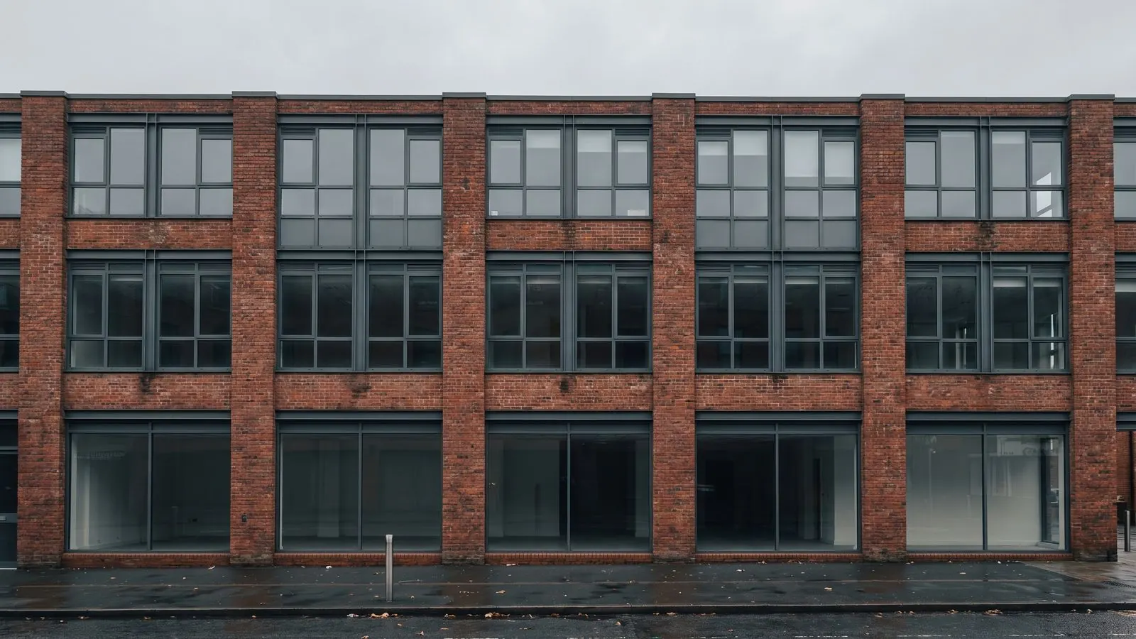 The brick and glass elevation of a four-storey commercial building
